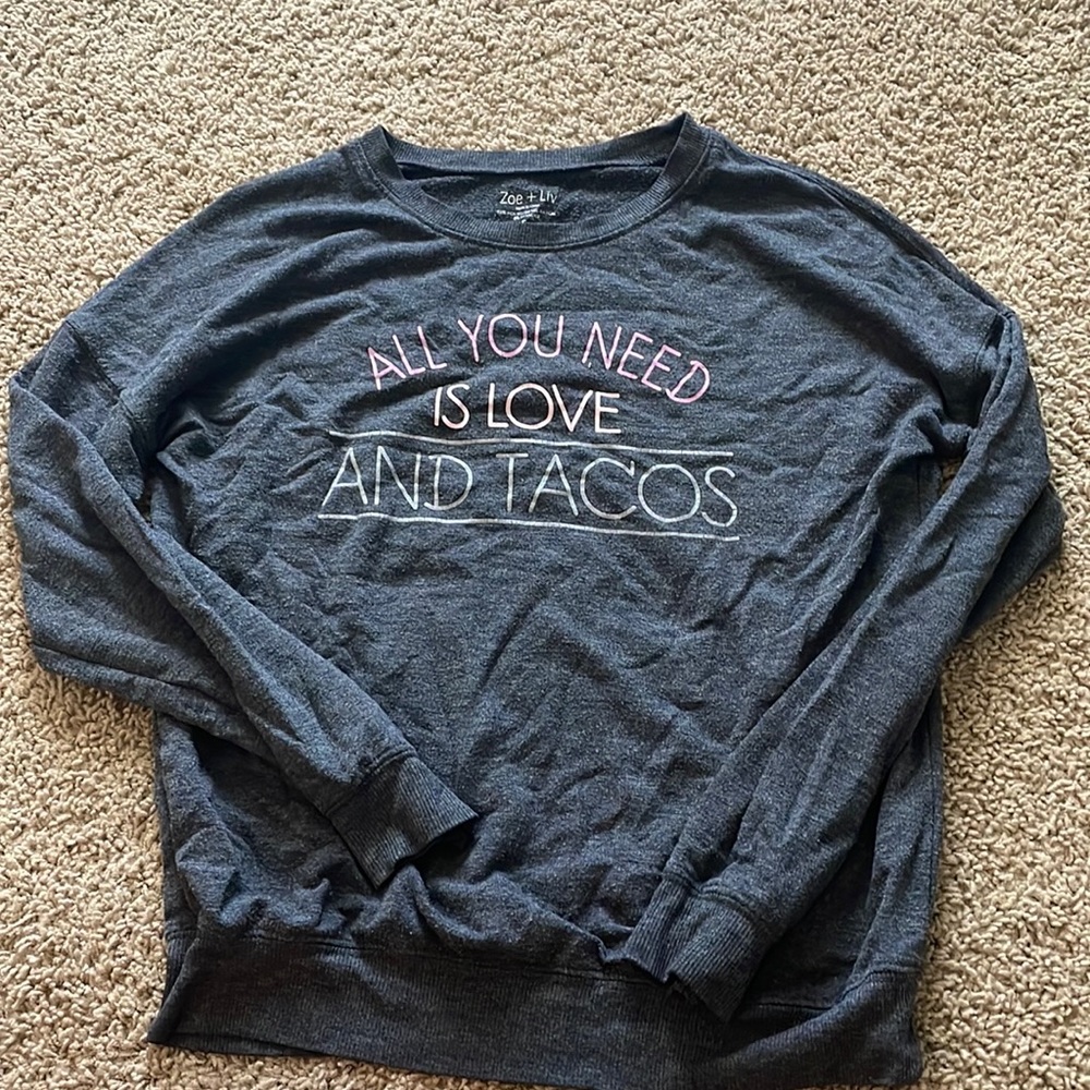 I am selling a black sweater from Zoe and Liv.